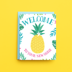 Greeting card with pineapple illustration and 'Welcome to your new home' text on a yellow background