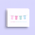 Card with baby onesies on a clothesline and text 'Big things come in small packages' on a purple background