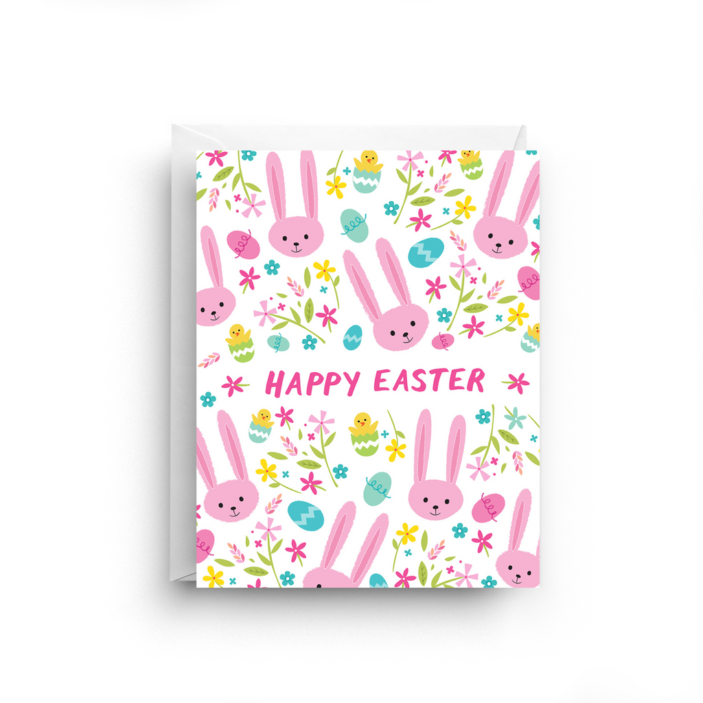 Easter-themed greeting card with pink bunnies, colorful eggs, and flowers on a white background.