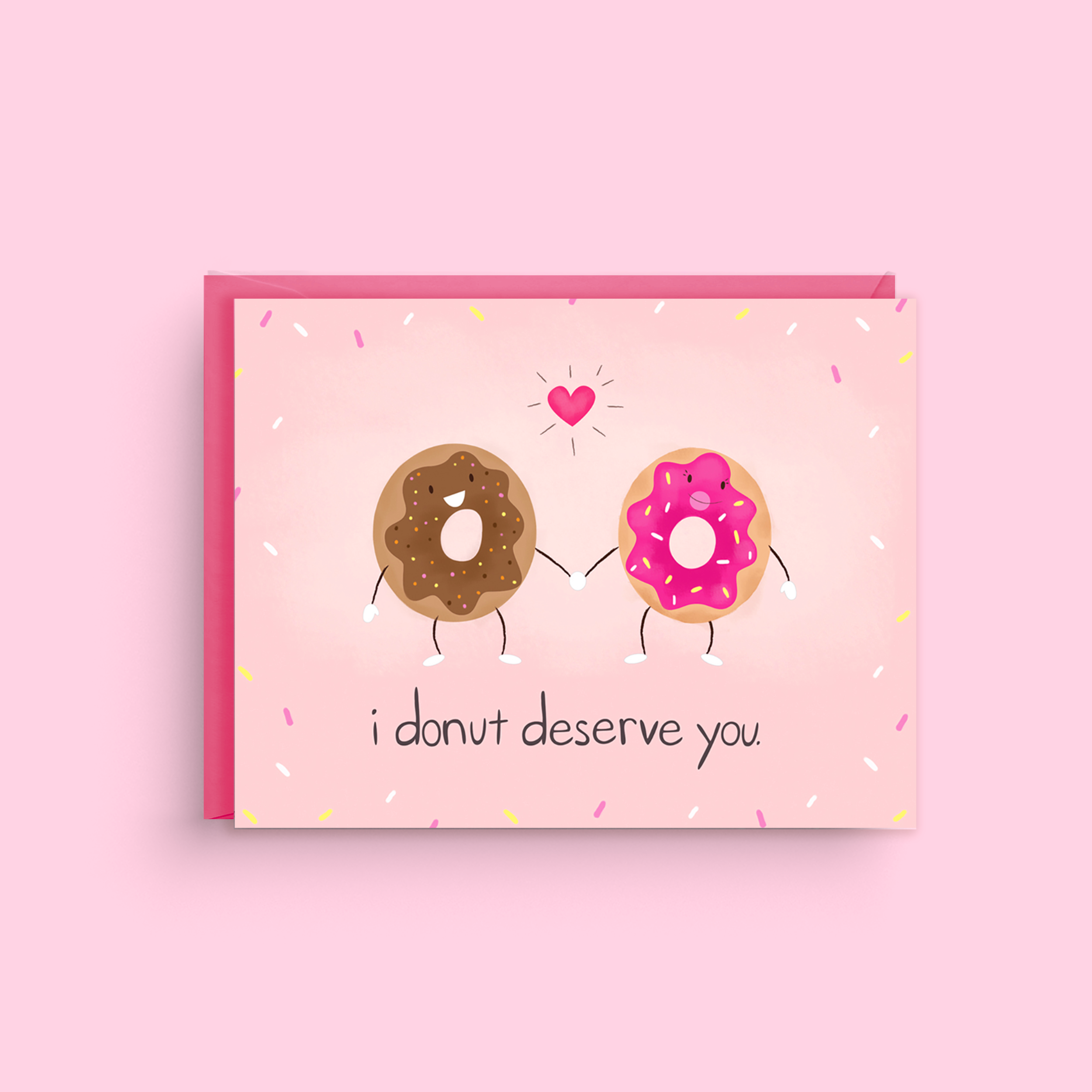 Card with cartoon donuts and text 'i donut deserve you' on a pink background