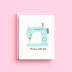 Illustrated vintage blue sewing machine with heart greeting card with I'm Sew Into You message
