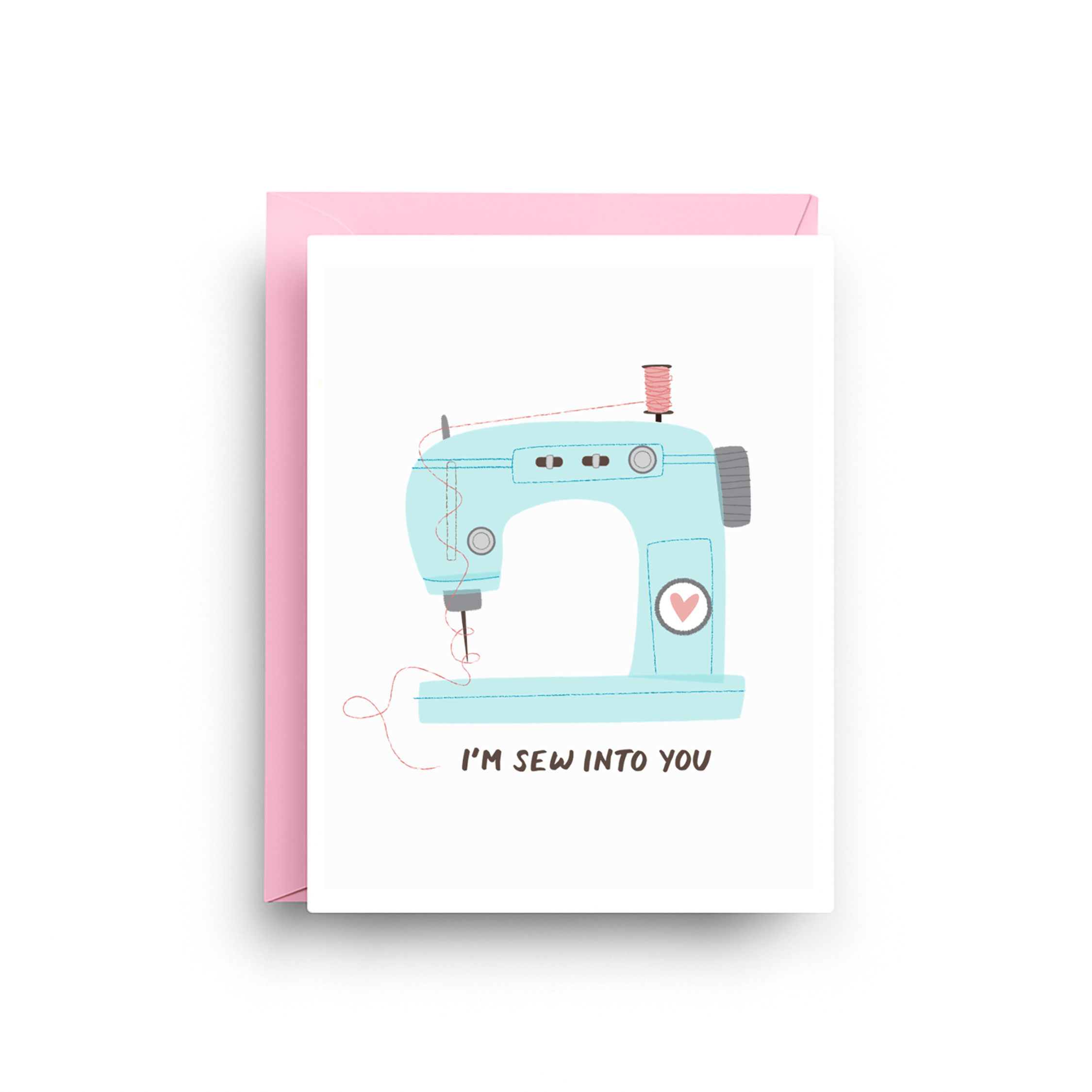Greeting card with a blue sewing machine illustration and text 'I'm sew into you' on a white background.