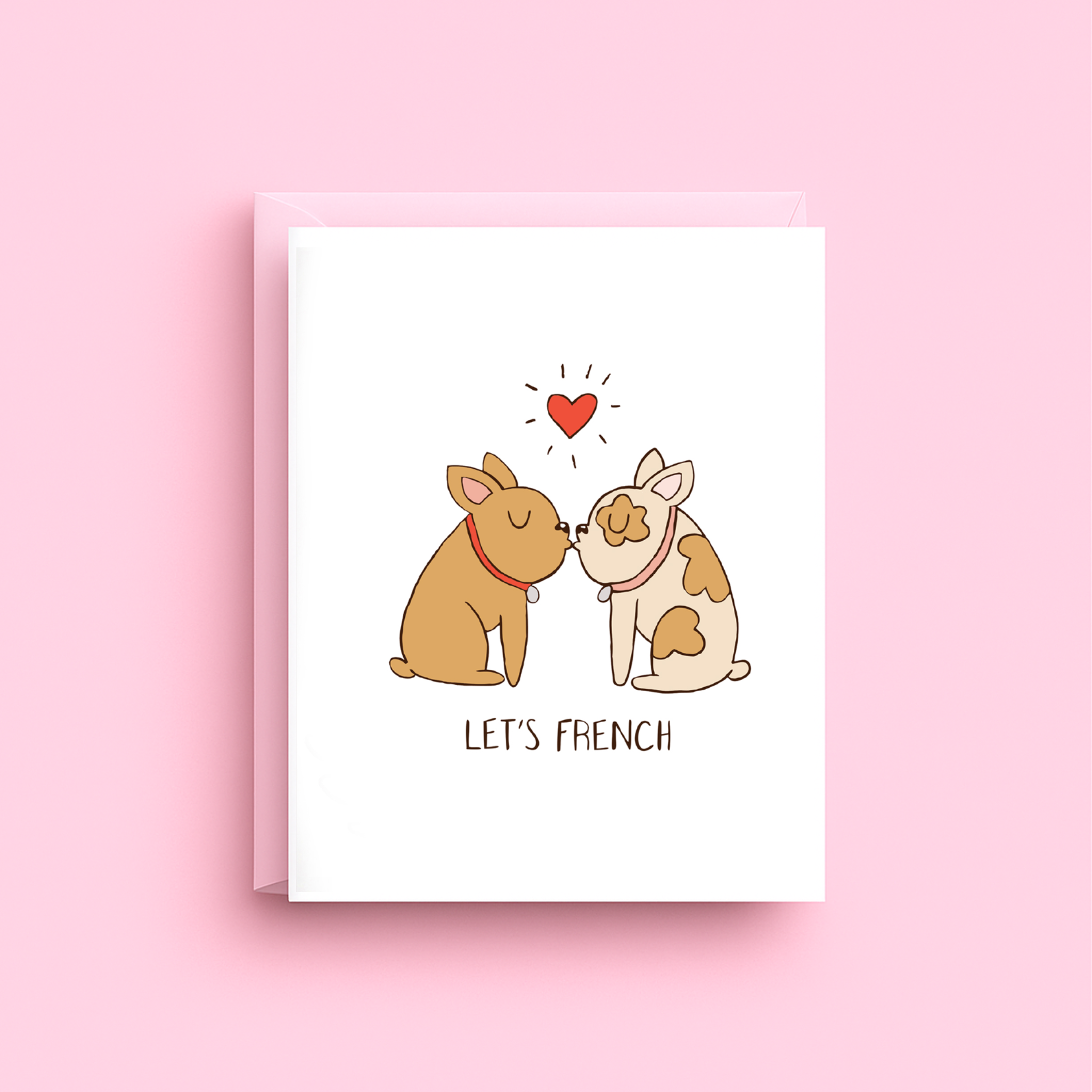 Greeting card with two dogs kissing and a heart above them on a pink background