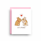 Greeting card with two dogs kissing and a heart above them, with text 'Let's French' on a white background.