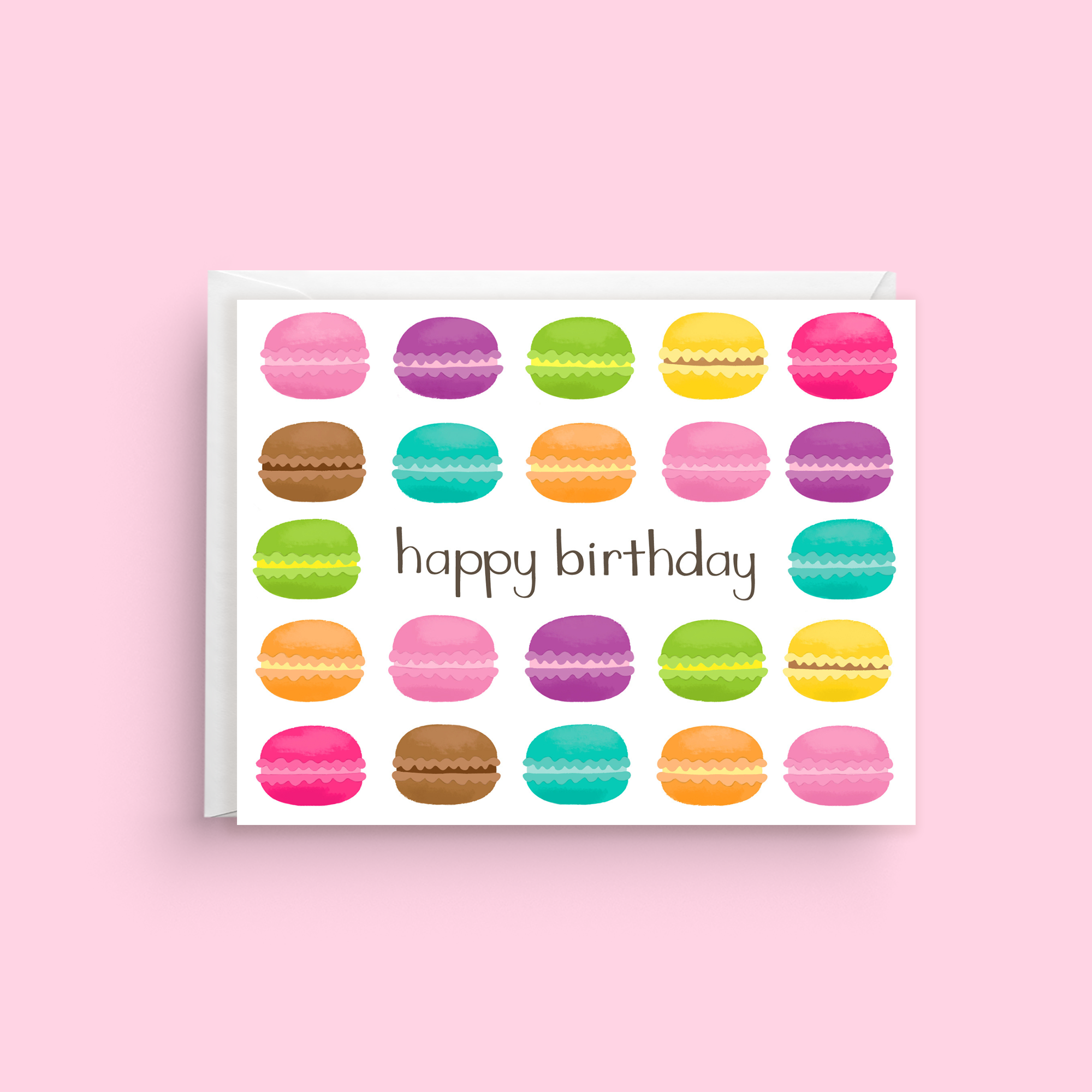 Greeting card with colorful macaron illustrations and 'happy birthday' text on a pink background