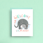 Greeting card with elephants and 'Welcome L'il Peanut' text on a light green background