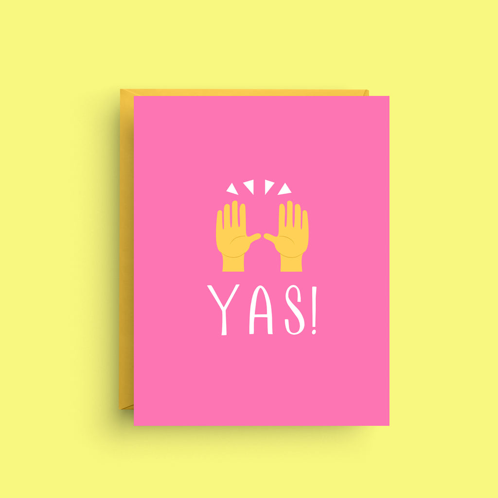 Pink card with yellow hands and 'YAS!' text on a yellow background