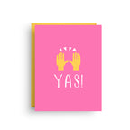 Pink card with yellow hands and 'YAS!' text on a white background